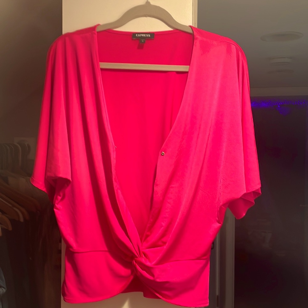 An express hot pink shirt. Worn twice. Looks brand new.